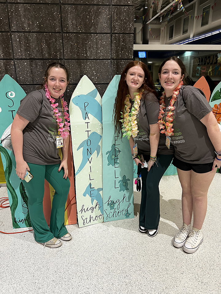 Three students post while attending student council conference